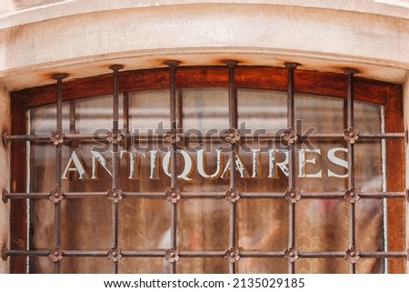 Ancient window in an antique shop. Royalty-Free Stock Photo #2135029185