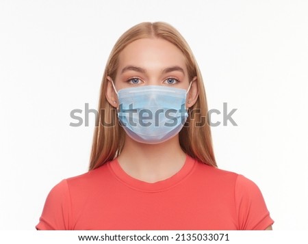 Girl in a medical mask protecting from viruses and air pollution, isolated on white background