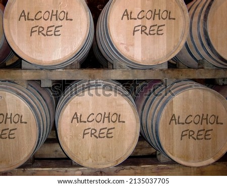 Barrels in cellar with text alcohol free. Royalty-Free Stock Photo #2135037705