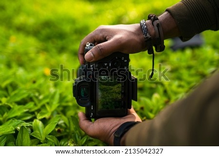 Photography concept image, Photographer taking picture of beautiful nature, Nature Photography Day concept image
