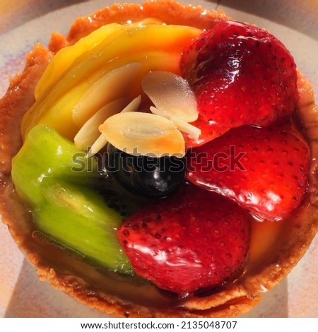 Top view of Fresh fruit tartlets on  plate