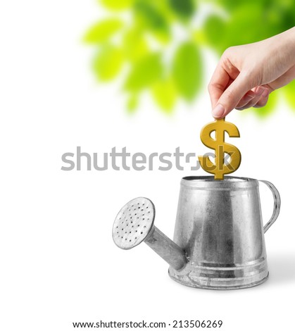 Business concepts of woman hand holding dollar sign over watering can