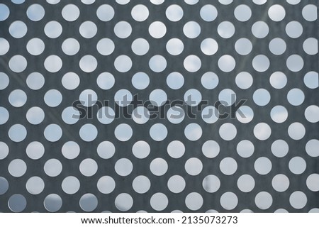 WHITE DOTS on a gray iron background