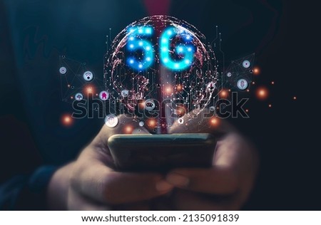 Hand man using mobile phone  with circle network communication technology for 5G.Data in the global computer social.telecommunication,earth.photo modern technology and communication concept.
