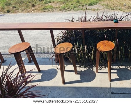 external wooden chairs long table