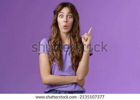Got it eureka. Excited enthusiastic creative cute european girl raise index finger folding lips wow great found solution suggest perfect plan stand purple background thrilled give good advice