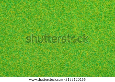 Realistic simulation of green grass. Craft paper. Artificial lawn. Turf paper texture