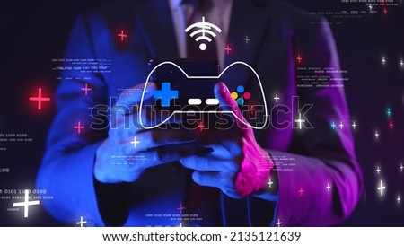 GameFi DeFi futuristic NFT Game decentralized finance play to earn, online digital technology. Businessman with mobile phone graphic icon modern game business investment idea