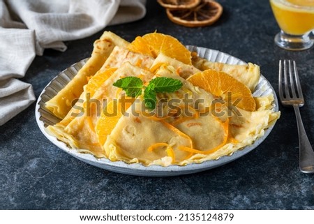 Crepes Suzette - French pancakes with orange liqueur sauce Royalty-Free Stock Photo #2135124879