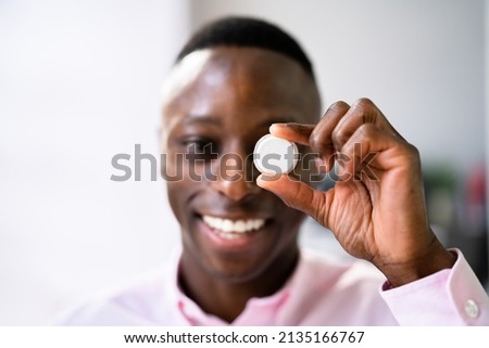 Man Holding Continuous Glucose Monitor For Testing Glucose Level Royalty-Free Stock Photo #2135166767