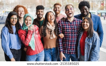 Young diverse people having fun outdoor laughing together - Diversity concept - Main focus on right man face Royalty-Free Stock Photo #2135185025