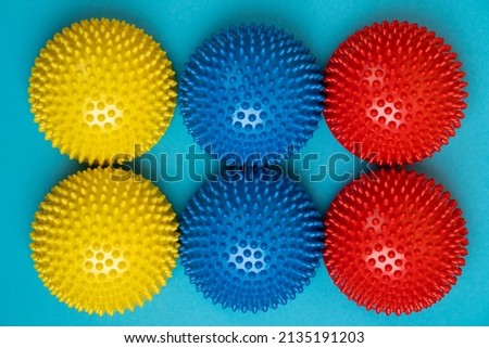 colored balancers on a light blue background, treatment and prevention of flat feet, hallux valgus.