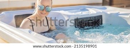 BANNER, LONG FORMAT Portrait of young carefree happy smiling woman relaxing at hot tub during enjoying happy traveling moment vacation life against the background of green big mountains