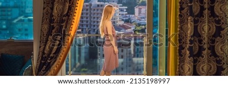 BANNER, LONG FORMAT Woman on the balcony against the backdrop of mountains and city, Montenegro. life terrace pretty happiness summer home. Inspiration city romantic hotel