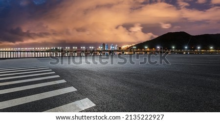 Empty asphalt road platform and mountain with cloud scenery at night Royalty-Free Stock Photo #2135222927