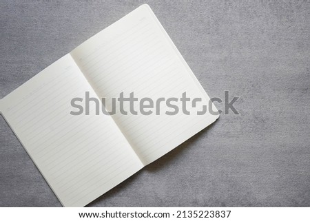 Blank page notebook minimalist. Isolated in conrete textured background. 