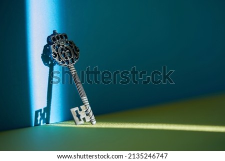 vintage key on blue and yellow background            Royalty-Free Stock Photo #2135246747