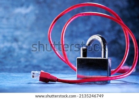 Security concept: broken padlock and network cable