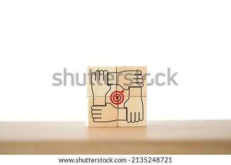 wooden cube screening teamwork  icon standing with red dartboard inside included copy space. Target for business management, teamwork, collaboration, achieve a common goal Royalty-Free Stock Photo #2135248721