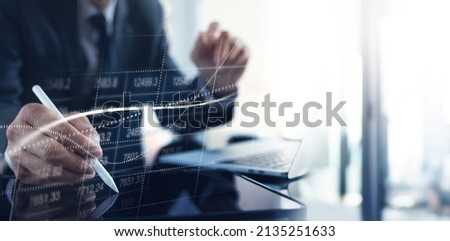 Businessman using digital tablet analyzing sales data and market growth, financial graph chart on virtual screen. Business strategy, finance and investment concept, business and technology background Royalty-Free Stock Photo #2135251633
