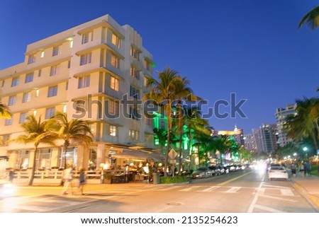 Blurred movements on Ocean Drive, Miami Beach at night.