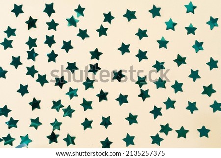 Seamless pattern with blue stars on a yellow background. Horizontal photo. Wallpaper, texture, background for your design and copy space.