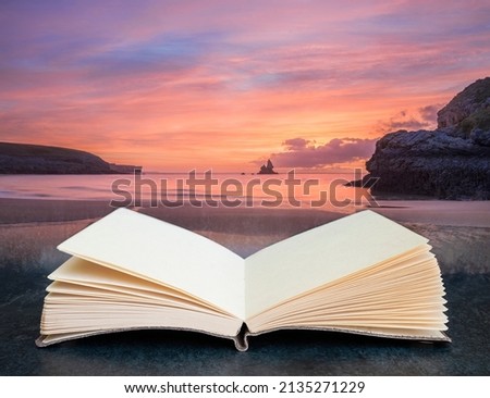 Digital composite image of Stunning sunrise landsdcape of idyllic Broadhaven Bay beach on Pembrokeshire Coast in pages of imaginary open reading book