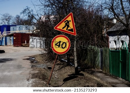 Road sign and symbol.  Road repair and speed limit for cars.