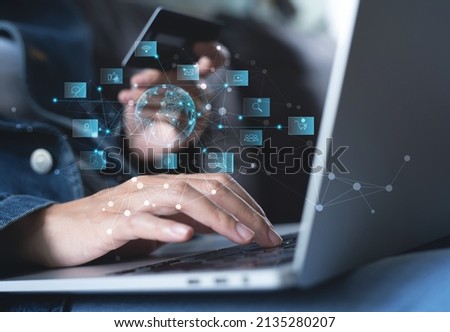 IoT Internet of Things, Global business, E-commerce, online shopping and banking concept. Woman using laptop computer for online shopping and internet banking, technology icons and virtual globe