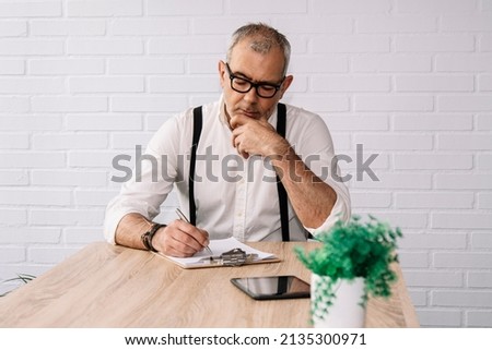 businessman in the office with document to sign
