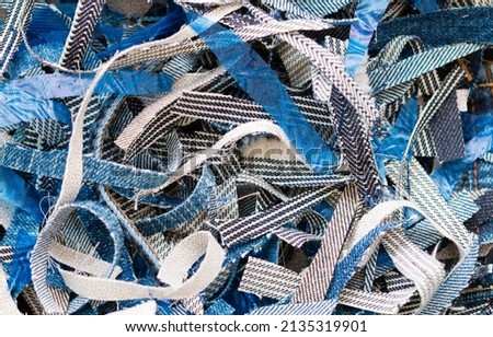 Scraps of cut fabric. Close-up of fabric parts Royalty-Free Stock Photo #2135319901