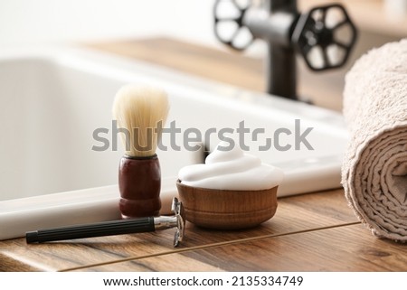 Male accessories for shaving on table in bathroom Royalty-Free Stock Photo #2135334749