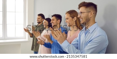 Banner narrow shot of overjoyed diverse businesspeople applaud show appreciation and acknowledgement. Smiling employees clap hands greeting or congratulating with promotion. Royalty-Free Stock Photo #2135347581