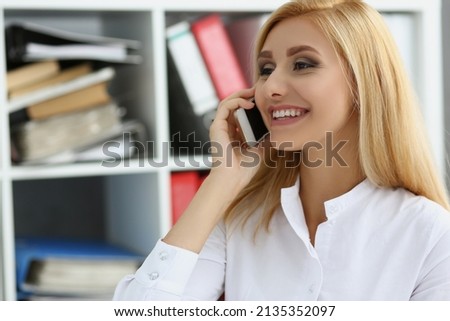 Happy worker talk on phone, chatting during work time, lazy employee Royalty-Free Stock Photo #2135352097