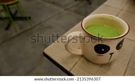 delicious green tea in a panda shaped cup