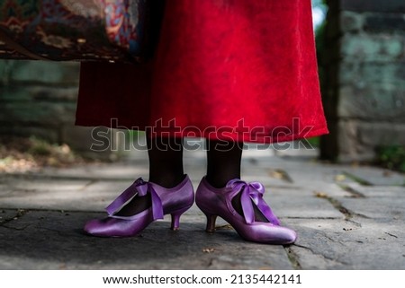 A movie Mary Poppins has been recreated. This photoshoot was designed to recreate the vide and the customs were made by the model. Royalty-Free Stock Photo #2135442141