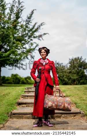 A movie Mary Poppins has been recreated. This photoshoot was designed to recreate the vide and the customs were made by the model. Royalty-Free Stock Photo #2135442145