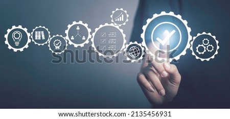 Quality management, Quality Control Certification Assurance Guarantee Business, standardisation and certification concept. Optimisation industrial technology. Hand touch checked guarantee icons. Royalty-Free Stock Photo #2135456931