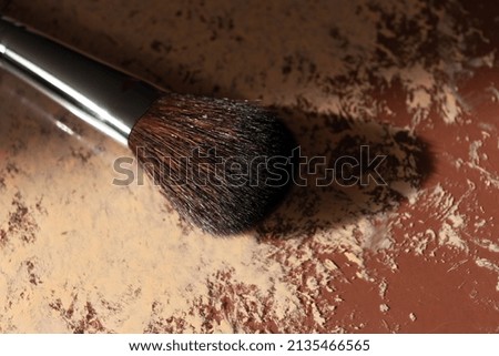 a black powder brush that you can use while applying your makeup
