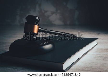 judge gavel with book on wooden background