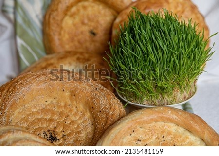 Uzbek bread from tandoor with raisin and greens,patir, round bread. Navruz, Navroz, Nowruz.