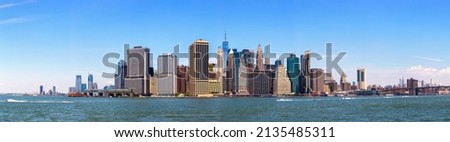 Panorama of Manhattan cityscape and Brooklyn Bridge in New York City, NY, USA Royalty-Free Stock Photo #2135485311