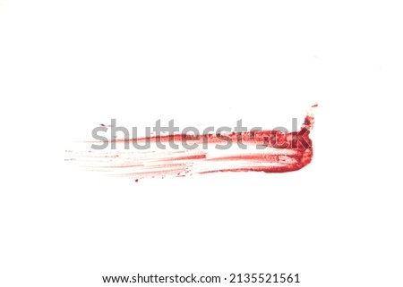 The smear and texture of lipstick. The pink color is highlighted on an isolated white background. An element for beauty cosmetic design. High quality photo