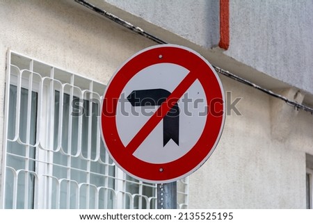 No left turn. Alley traffic rule in Turkey. Left turn forbidden. Red round traffic sign. Left black arrow icon.