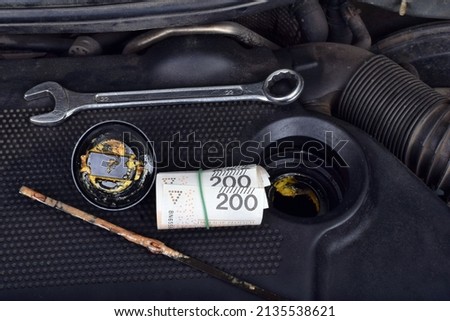  Polish money currency and the thick, greasy yellow motor oil under oil cap as signs and symptom of a blown head gasket