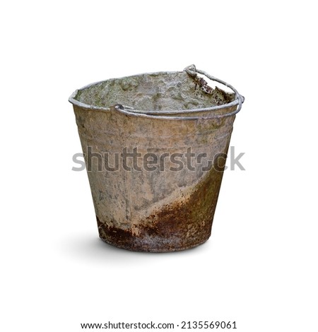 Old dirty rusty bucket with the remains of dried cement isolated on white background. Royalty-Free Stock Photo #2135569061