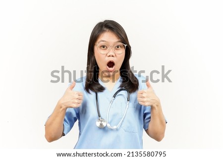 Showing Thumbs Up Of Asian Young Doctor Isolated On White Background