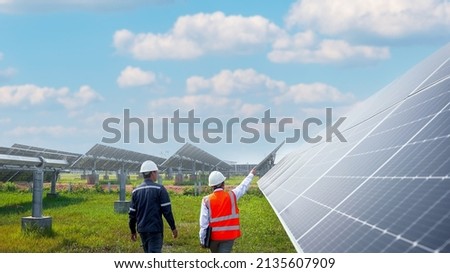 Engineers take investors on a tour of solar power plants. solar panels are an alternative electricity source to be sustainable resources in the future. The clean energy concept saves the world. Royalty-Free Stock Photo #2135607909