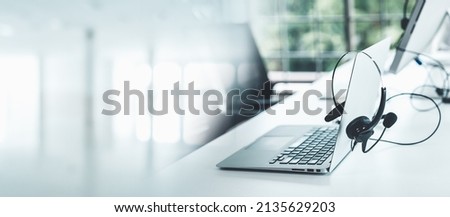 Headset and customer support equipment at call center ready for actively service . Corporate business help desk and telephone assistance concept . Royalty-Free Stock Photo #2135629203