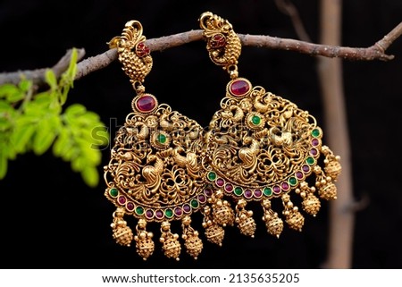 Beautiful Indian Antique Golden pair of earrings, Luxury female jewelry, Indian traditional jewellery,Indian jewelry Bridal earrings wedding jewellery heavy party earrings Royalty-Free Stock Photo #2135635205
